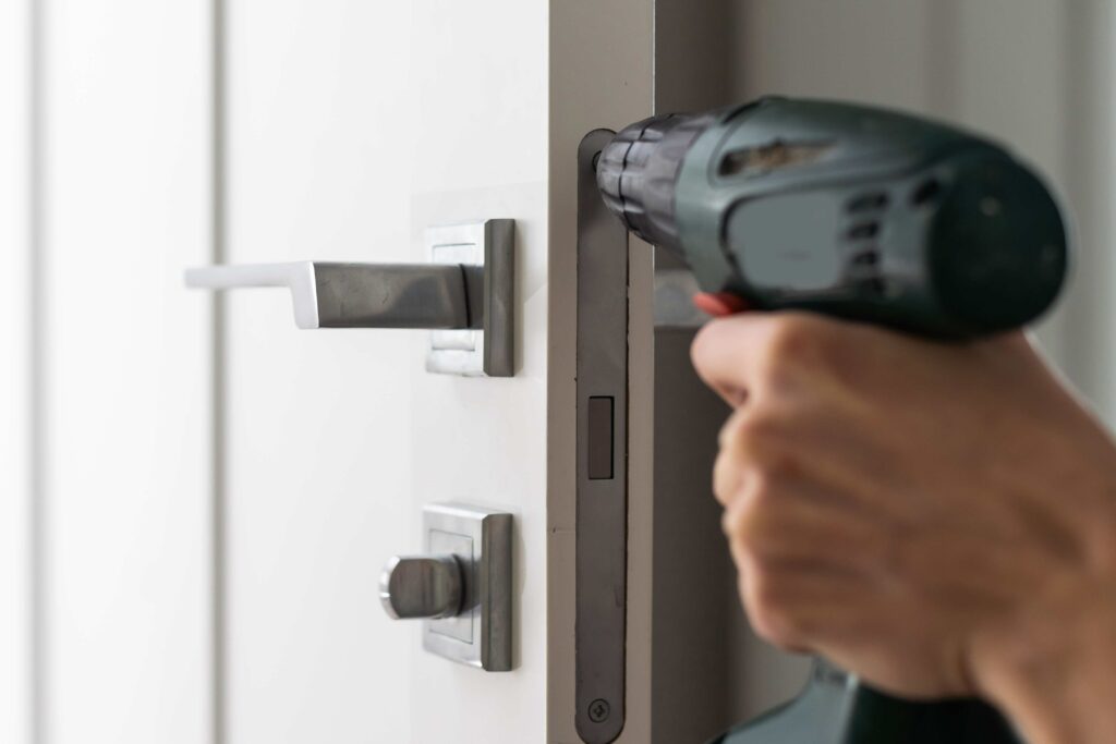 a handyman repair the door lock in the room the c 2024 02 01 12 23 06 utc
